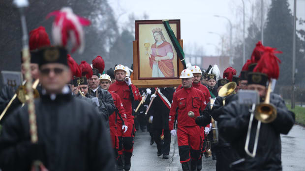 Coal miners from Poland's Pniowek coal mine carry a painting of Saint Barbara on Barbórka, their annual day of tribute to Barbara, from the mine to their local church on December 4th, 2018, in Pawlowice, near Wodzislaw Slaski, Poland. Barbara is the patron saint of coal miners, and every December 4th, miners across Poland celebrate her with a march, a religious mass, and a festive gathering. Coal provides about 80 percent of Poland's electricity. The mines, many of them in the region of Silesia in southern Poland, employ tens of thousands of workers. Meanwhile, the United Nations' COP 24 climate conference is taking place in nearby Katowice.