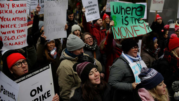Educators from the Acero charter school network hold signs as they protest during a strike outside Chicago Public Schools headquarters on December 5th, 2018, in Chicago, Illinois. Teachers are asking for smaller class sizes, fair pay, and better resources to continue teaching the more than 7,000 students who attend Acero schools.