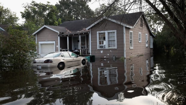 Floodwater surrounds a home after torrential rains pounded Southeast Texas following Hurricane and Tropical Storm Harvey, causing widespread flooding, on September 3th, 2017, in Orange, Texas.