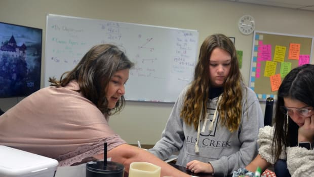 Math teacher Charity Hobbs helps her students prepare for the ACT test. Hobbs taught in a small school in Shawnee, Oklahoma, before joining the Academy of Seminole charter school when it opened this fall.