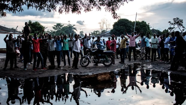 Supporters of the Democratic Republic of the Congo's Union for Democracy and Social Progress party demonstrate outside the party headquarters in Kinshasa on December 20th, 2018, to protest against the postponed elections. The DRC's troubled journey to elect a successor to the incumbent president hit a new snag on December 20th, three days before voting, as electoral supervisors ordered a week-long postponement after a fire destroyed polling equipment.