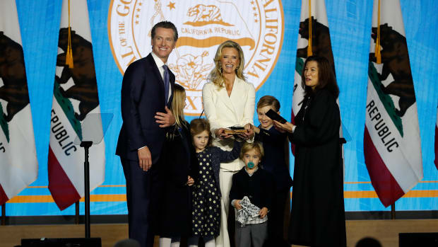 Gavin Newsom is sworn in as governor of California by California Chief Justice Tani Gorre Cantil-Sakauye as Newsom's wife, Jennifer Siebel Newsom, watches on January 7th, 2019, in Sacramento, California.