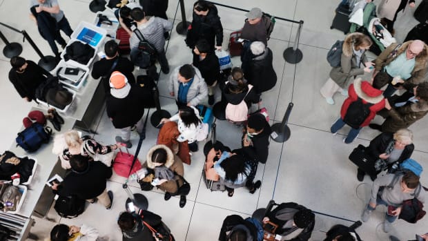 Passengers wait in a Transportation Security Administration line at John F. Kennedy International Airport on January 9th, 2019, in New York City. It has been reported that hundreds of TSA screeners and agents have called in sick from their shifts at a number of major airports as the partial government shutdown continues. Employees of the TSA, whose job it is to keep airlines safe, are working without knowing when their next paycheck is coming.