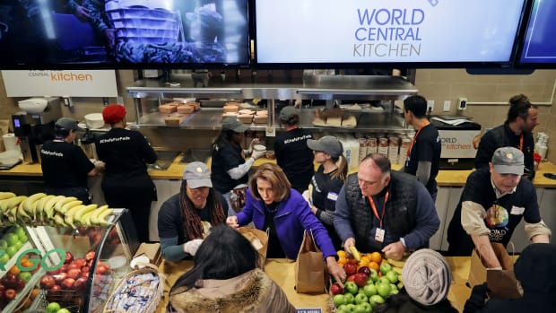 United States Speaker of the House Nancy Pelosi (center) and celebrity chef Jose Andres (second from the right) help distribute food to furloughed federal workers at the World Central Kitchen on January 22nd, 2019, in Washington, D.C. Founded by Andres, World Central Kitchen is a not-for-profit non-governmental organization devoted to providing meals in the wake of natural disasters—and, in this case, the government shutdown. The kitchen has been providing meals to workers affected by the partial federal government shutdown since January 16th and started giving away groceries and providing other services this week.