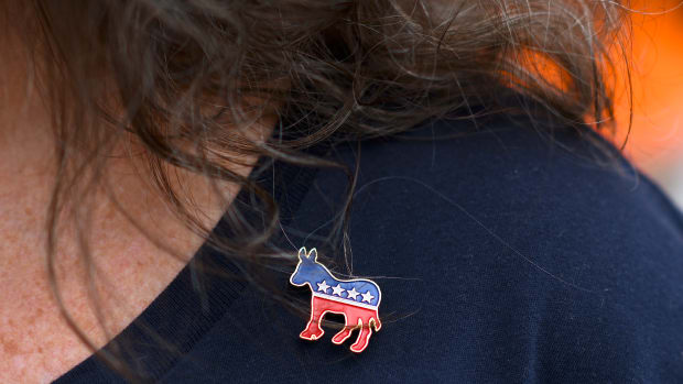 PHILADELPHIA, PA - SEPTEMBER 21: Donna Elms wears a Democrat donkey pin while lining up outside in advance of a campaign rally with former President Barack Obama, Pennsylvania Governor Tom Wolf, and Senator Bob Casey (D- PA) on September 21, 2018 in Philadelphia, Pennsylvania. Midterm election Day is November 6th.