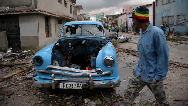 A car damaged by debris from a building is seen in Havana, Cuba, after a rare and powerful tornado struck the city on Monday, January 28th, 2019, killing three people and leaving 172 injured, Cuban President Miguel Diaz-Canel said early Monday.