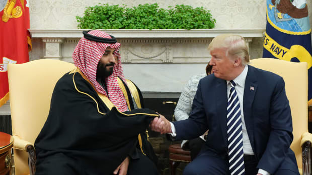 President Donald Trump shakes hands with Saudi Arabia's Crown Prince Mohammed bin Salman.