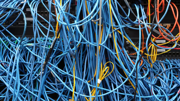 Network cables are plugged in a server room
