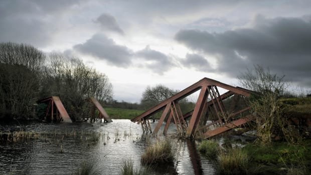 The remains of a railway bridge between the villages of Blacklion in the Republic of Ireland and Belcoo in Northern Ireland can be seen on February 22nd, 2019, in Belcoo, Northern Ireland. The bridge was blown up by the British army in the 1970s during the Troubles. Along the winding 499 kilometers of the Irish border are vestiges of a harder boundary: derelict customs houses, "dragon's teeth" bollards and two-toned tarmac. These relics evoke a time when movement between the countries was less free, and underscore what is at stake as the U.K. negotiates its exit from the E.U. Both parties have vowed to avoid a physical border, but, as the Brexit deadline approaches on March 29th, a final agreement has so far eluded them.
