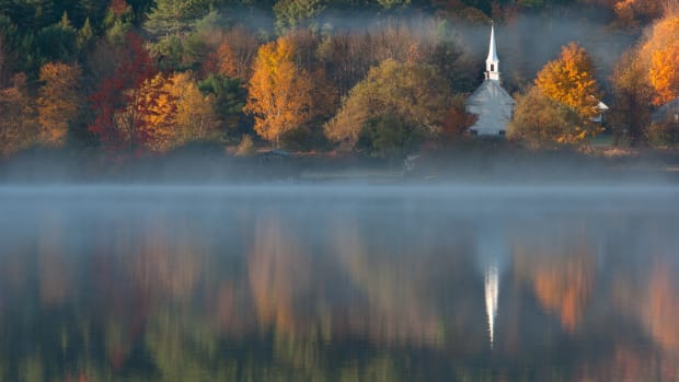Church in nature on lake Christianity