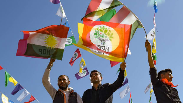 Men wave flags as they celebrate Nowruz festivities on March 21st, 2019, in Diyarbakir, Turkey. Nowruz, which starts on the vernal equinox and marks the Iranian New Year, is celebrated by more than 300 million people in diverse communities across the world.