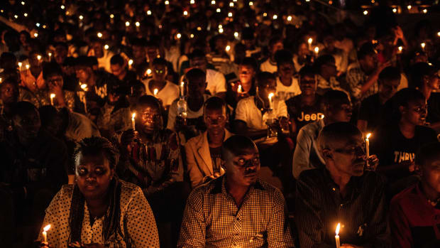 At a commemoration ceremony during the 25th anniversary of the Rwandan genocide, in which 800,000 Tutsis and moderate Hutus were killed over a 100-day period, people hold candles at Amahoro Stadium in Kigali, Rwanda, on April 7th, 2019.