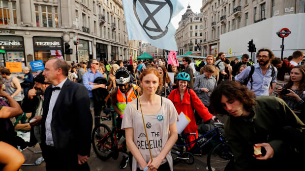 Climate change activists block the road junction at Oxford Circus in central London on April 18th, 2019, during an environmental protest by the Extinction Rebellion group. Climate change activists on Thursday brought parts of the British capital to a standstill on the fourth consecutive day of demonstrations.