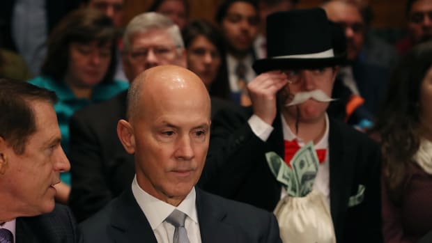 Former Equifax Chief Executive Officer Richard Smith prepares to testify before the Senate Banking, Housing and Urban Affairs Committee.
