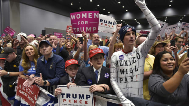 Supporters cheer as then-Republican presidential nominee Donald Trump arrives for a rally at the Sioux City Convention Center in Sioux City, Iowa, on November 6th, 2016.