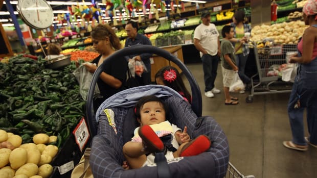 Zury Vizguerra, at age five months, waits while her mother, an undocumented immigrant from Mexico, shops for groceries on July 11th, 2011, in Aurora, Colorado.