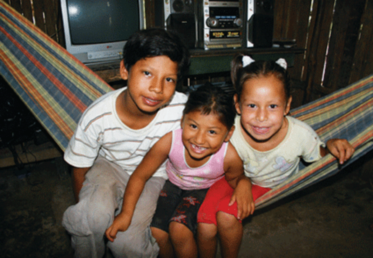 Blessa Veronica (middle) and two friends in the village of Yarina. (Todd Pitock)