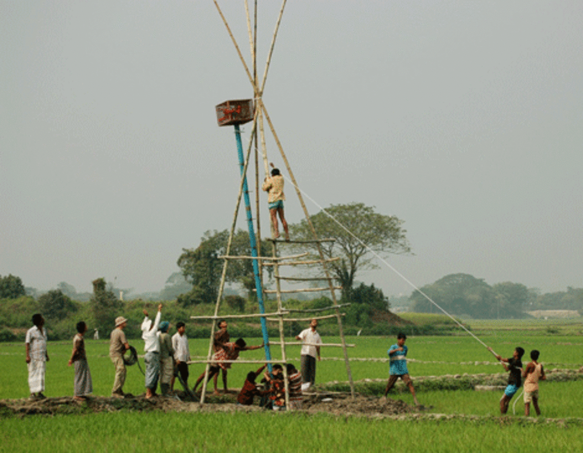 When set in place, this tower will protect data-logging electronics from monsoon floods in the Munshiganj district of Bangladesh. Underground wires connect the data-loggers to soil-condition sensors. (Courtesy of Charles Harvey)