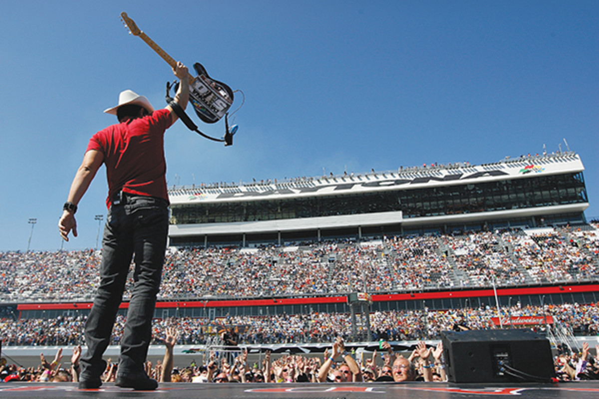 Brad Paisley, who has managed to write hugely popular country songs that touch on race and immigration, performs at the Daytona 500 in 2011. (Photo: Tom Pennington/Getty Images for NASCAR)