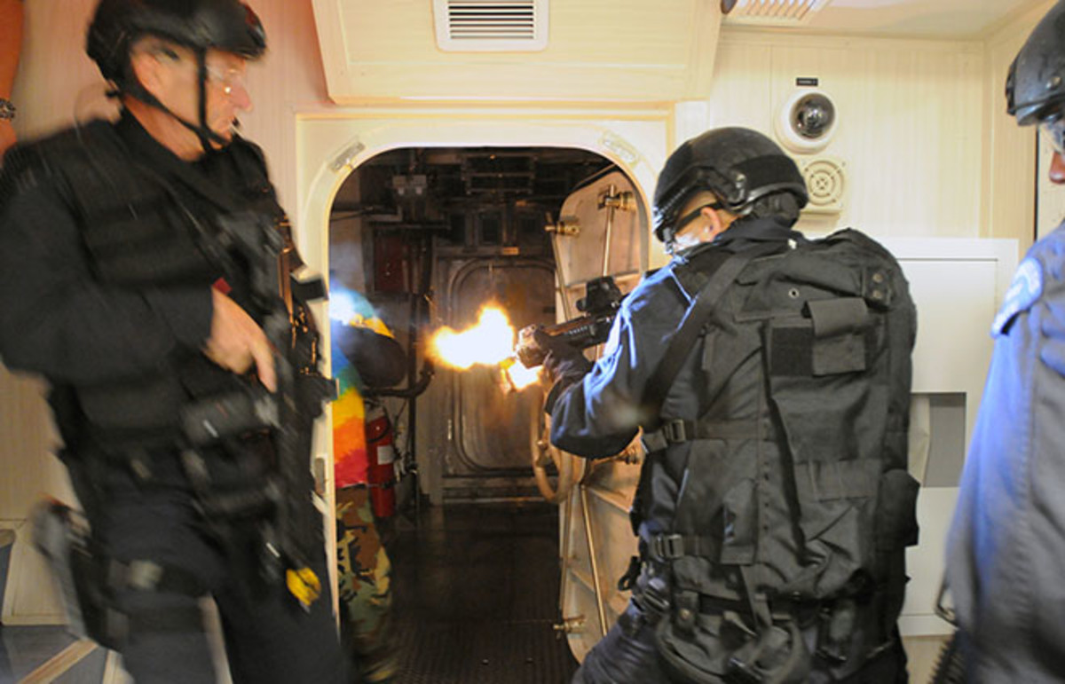 SWAT team members breach a room in a training exercise. (Photo: U.S. Navy/Flickr)
