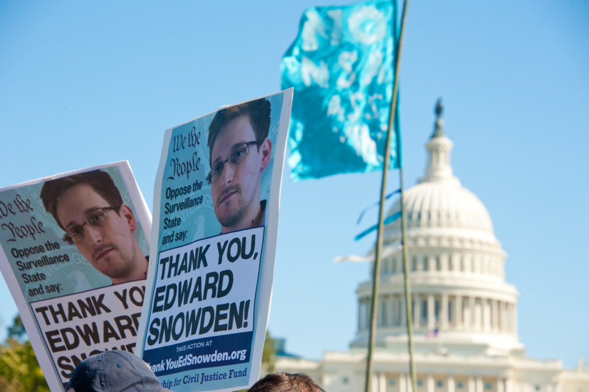 Signs held by protesters during a rally against mass surveillance in Washington, D.C., on October 26, 2013. (Photo: Rena Schild/Shutterstock)