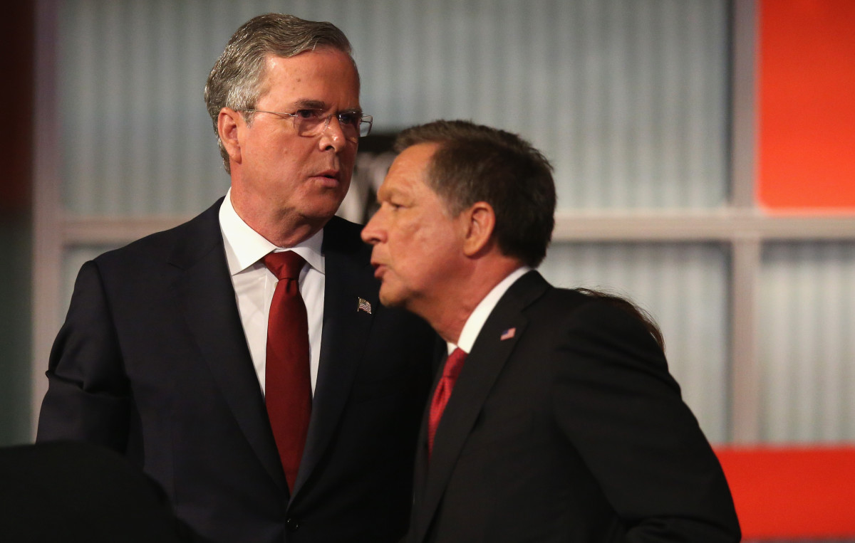 Republican presidential candidate Jeb Bush (left) and John Kasich talk at the Republican Presidential Debate on November 10, 2015, in Milwaukee, Wisconsin. (Photo: Scott Olson/Getty Images)