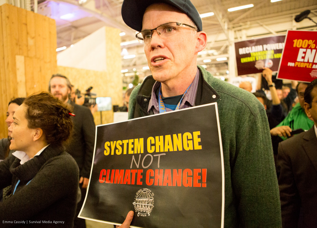 Bill McKibben during a sit-in at the Paris climate summit. (Photo: Emma Cassidy/Survival Media Agency)