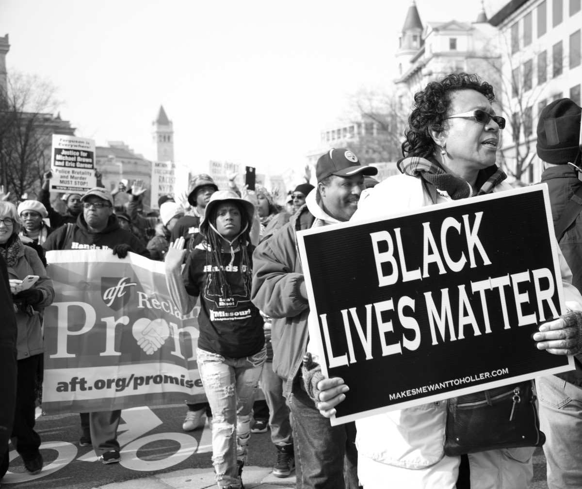 Protesters march against police shootings and racism during a rally in Washington, D.C., in 2014. (Photo: Rena Schild/Shutterstock)