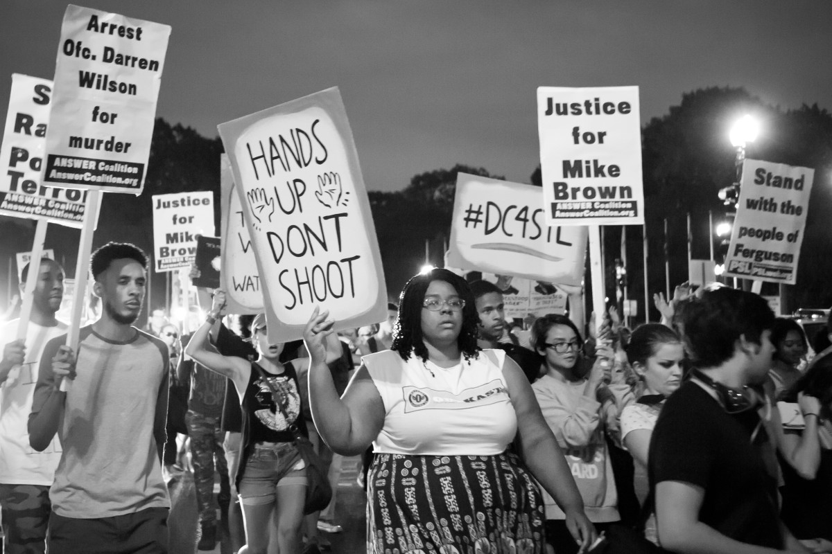 Marchers rally against racism after the shooting death of Mike Brown in  Ferguson, Missouri.  The march took place in Washington, D.C., on August  30, 2014. (Photo: Rena Schild/Shutterstock)