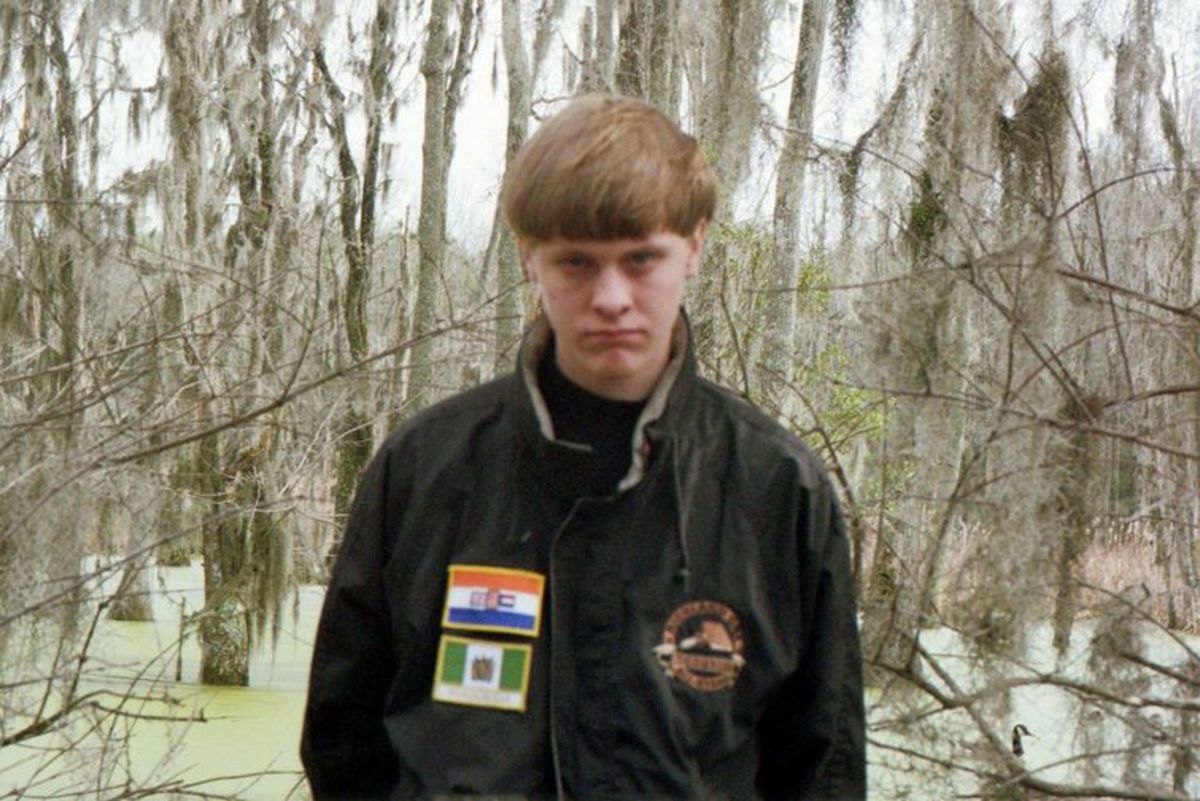 Dylann Storm Roof, with the apartheid South African (top) and Rhodesian flags. (Photo: Facebook)