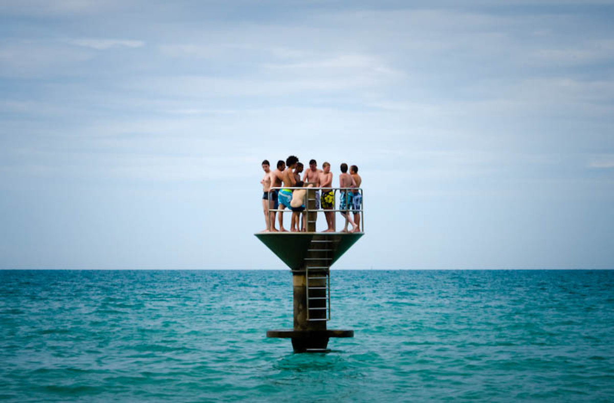Teens on a diving platform in France. (Photo: alainwibert/Flickr)