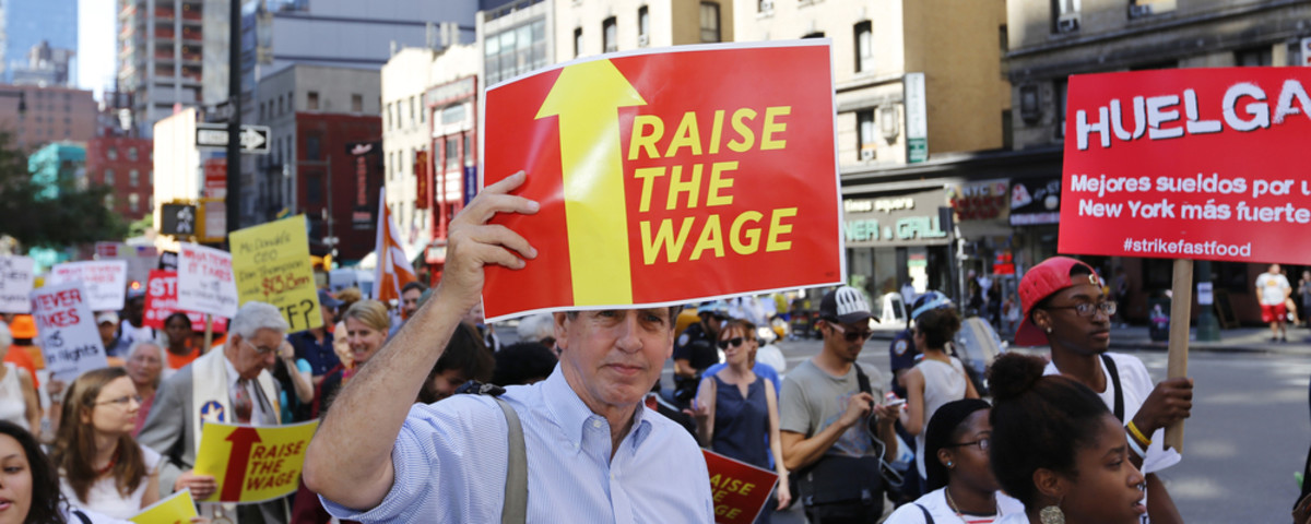 Fast-food workers and their supporters march in New York. (Photo: a katz/Shutterstock)