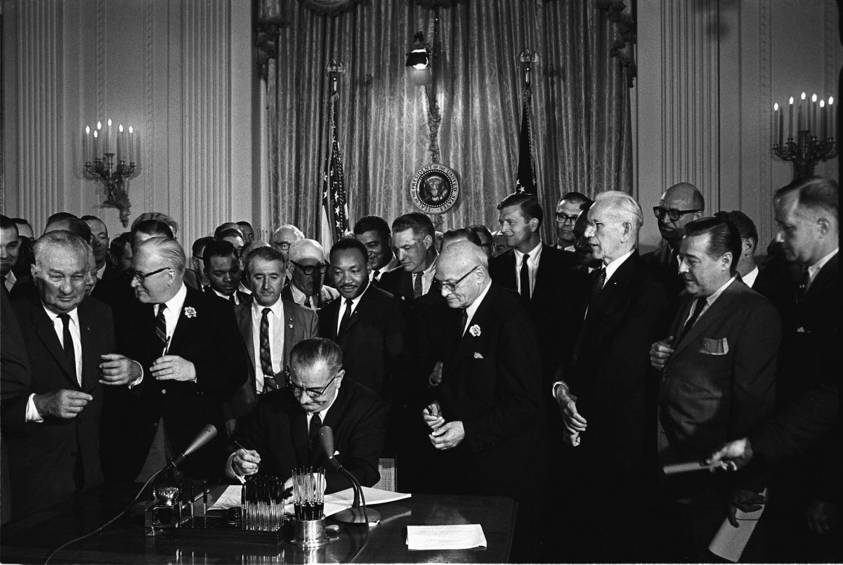 President Johnson signs the Civil Rights Act of 1964. (Photo: Cecil Stoughton/White House Press Office)