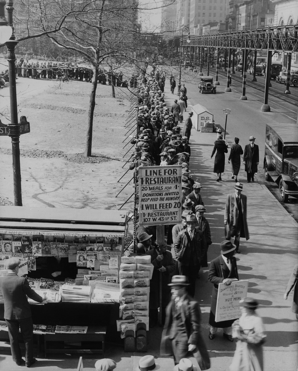 A 1930s breadline along Bryant Park in New York City. A sign advertised meals for one cent and requests donations. (Photo: Everett Historical/Shutterstock)