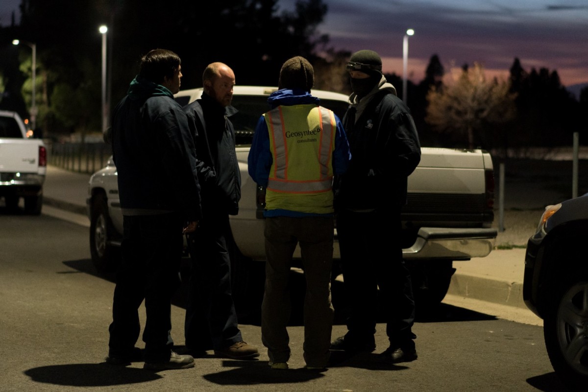 Employees and contractors of the Southern California Gas company huddle to discuss the night’s testing plan of chemical emissions on January 14th near the entrance to the Aliso Canyon storage facility where natural gas had been leaking since October.