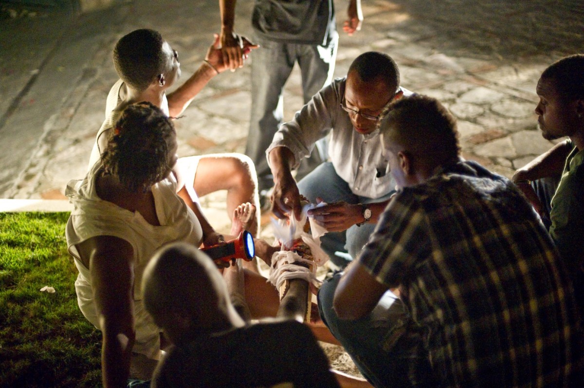 A wounded child gets relief from fellow Haitians on January 12, 2010 in Port-au-Prince, Haiti.
