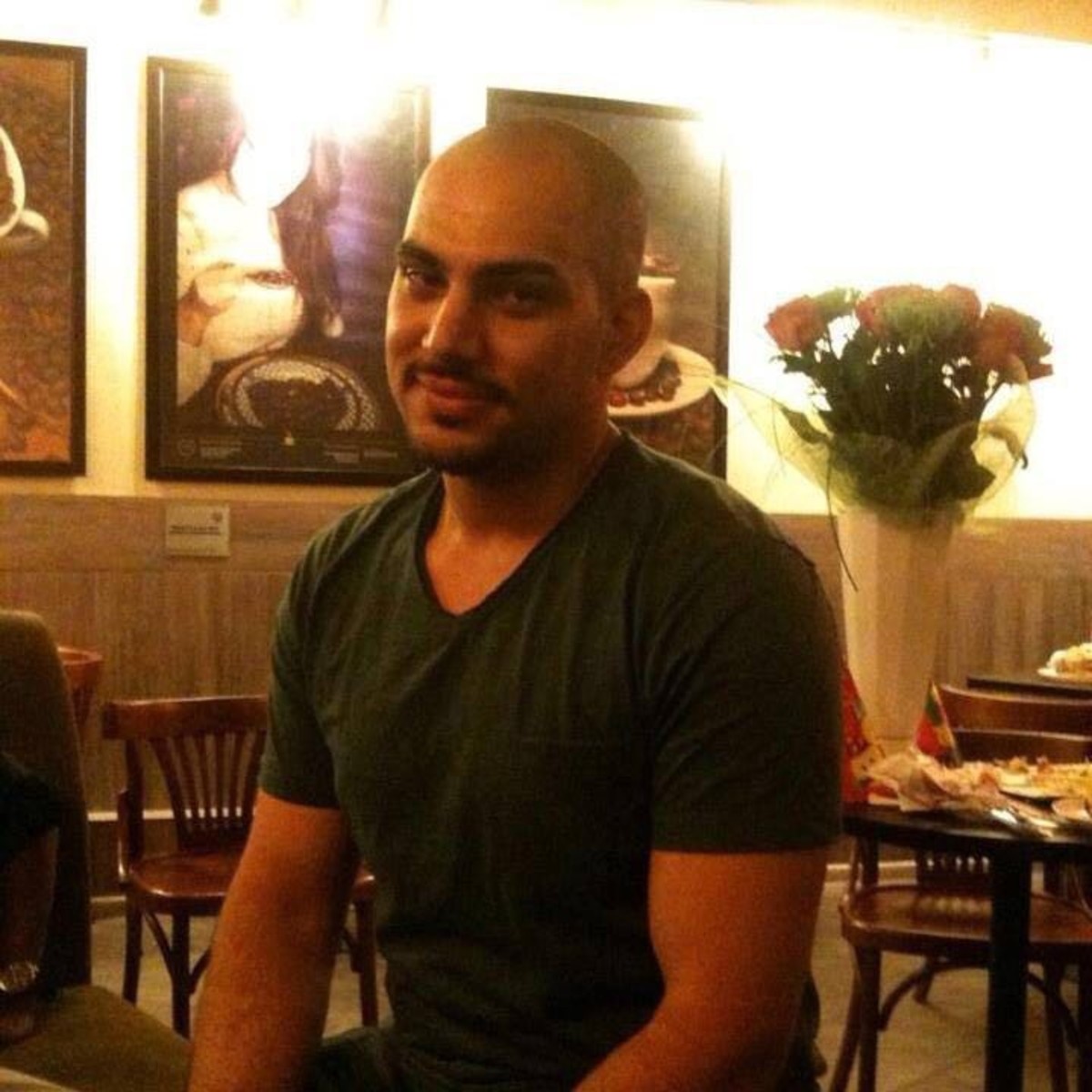 Photo of Mustafa Mousa sitting in a restaurant