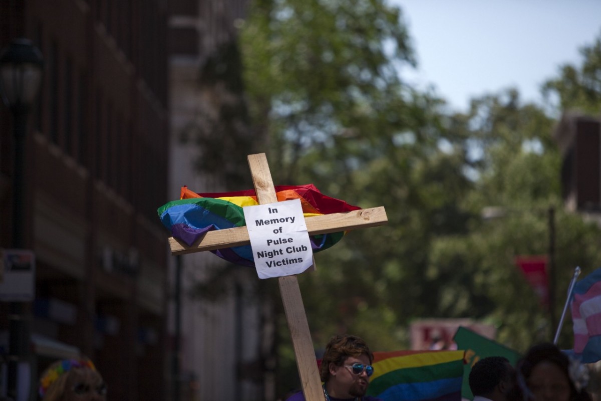 A sign for the Orlando victims is carried at Philadelphia’s Gay Pride Parade.
