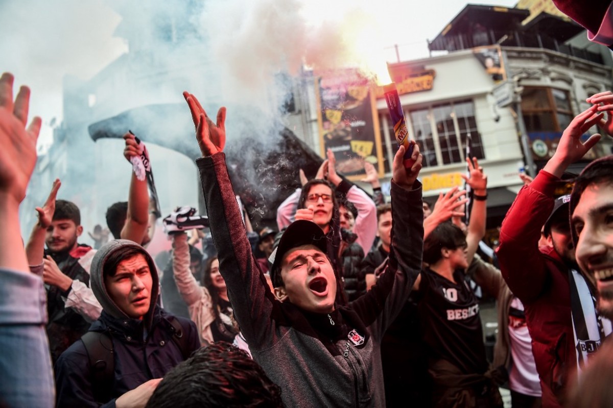 Beşiktaş’ supporters cheer on their team before the UEFA Europa League second leg quarter final match on April 20th, 2017. (Photo: Ozan Kose/AFP/Getty Images)