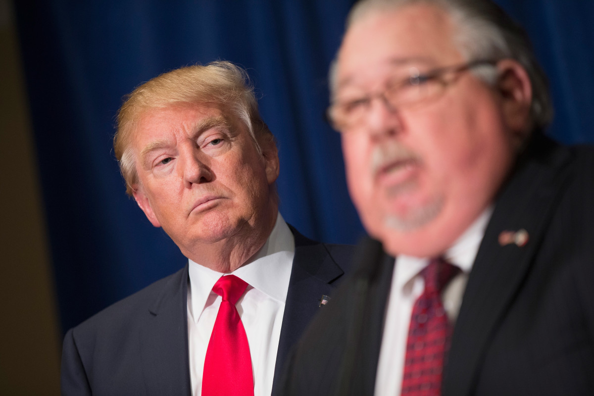 Sam Clovis speaks during a news conference with Donald Trump ahead of a rally in Grand River Center, Iowa, on August 25th, 2015.