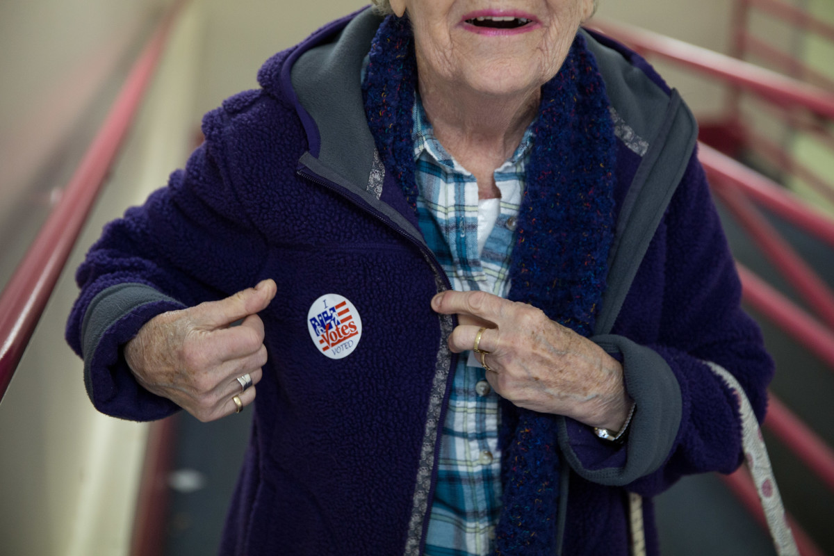 A woman receives a sticker after casting her vote at the Immaculate Conception Church on November 8th, 2016, in Penacook, New Hampshire.