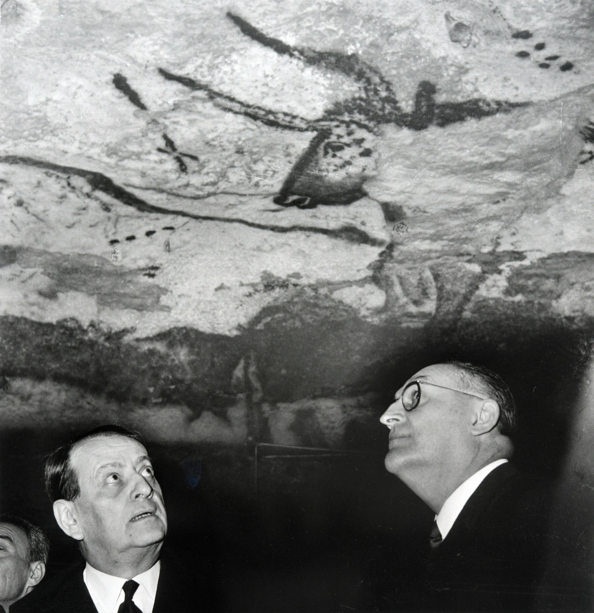 French Minister for Culture Andre Malraux (L) looks at the prehistoric paintings during his visits at the Lascaux caves, on March 13th, 1967.