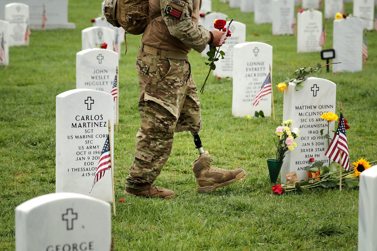 A veteran walks through Arlington National Cemetery in Arlington, Virginia, on May 29th, 2017.