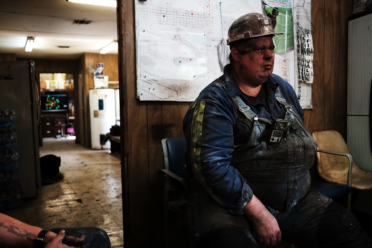 A coal miner takes a break after his shift at a small mine on May 19th, 2017, outside the city of Welch, West Virginia.