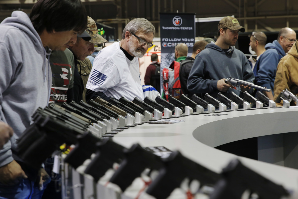 Visitors view gun displays at a National Rifle Association outdoor sports trade show on February 10th, 2017, in Harrisburg, Pennsylvania.
