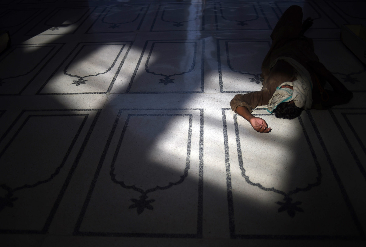 A Pakistani Muslim rests at a mosque during the holy month of Ramadan in Karachi on June 9th, 2017.