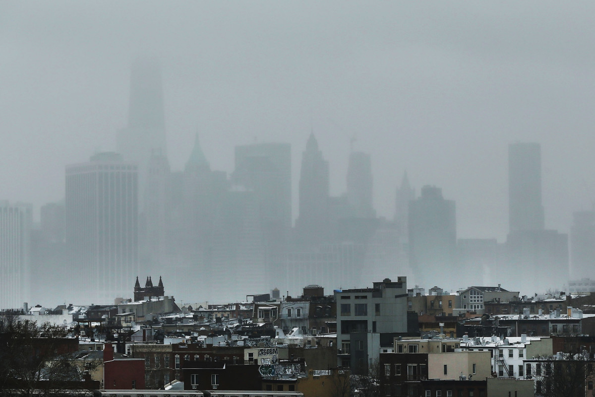 The New York City skyline, shrouded in snow and fog.