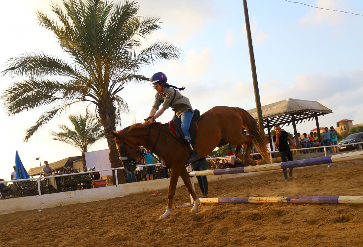 Seventeen-year-old Heba Seifalden Shahein, who was born with congenital amputation in one leg, trains at a riding school in Gaza City on July 5th, 2017. Heba, who lives between Norway and Gaza, started riding at the beginning of the year and she will compete in a local competition in July.