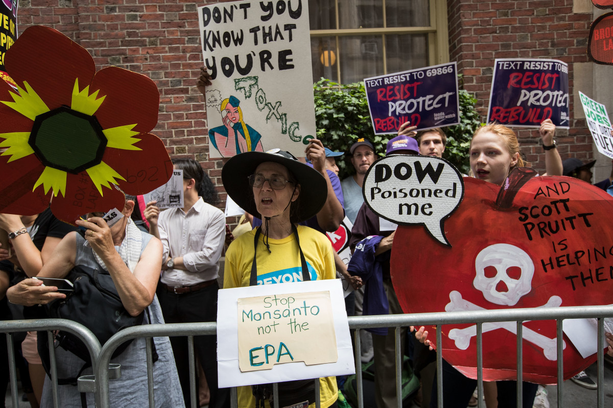 Environmental activists protest outside of the Harvard Club, where Environmental Protection Agency Administrator Scott Pruitt was scheduled to speak on June 20th, 2017, in New York City.