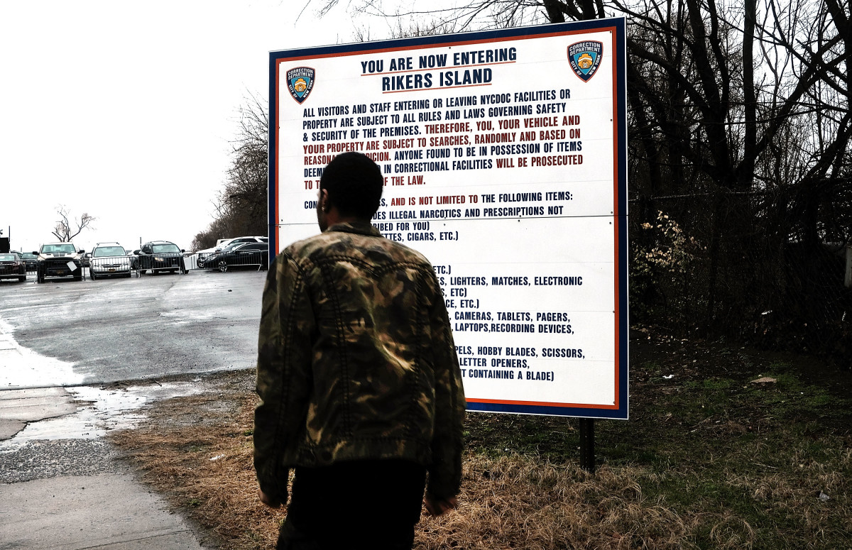 A man enters the road to Rikers Island on March 31st, 2017, in New York City.